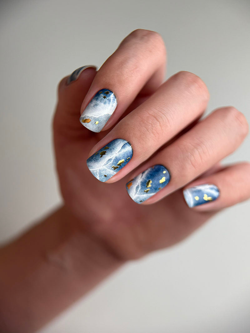 Manicure Cracks on dark blue. Gold Foil. Nail wraps WM-429