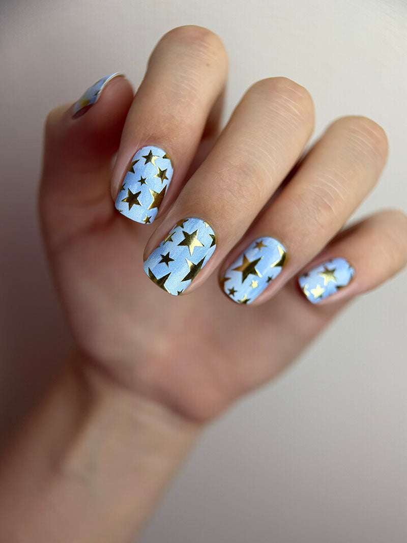 Manicure Stars. Blue Background. Gold Foil. Nail wraps WM-600