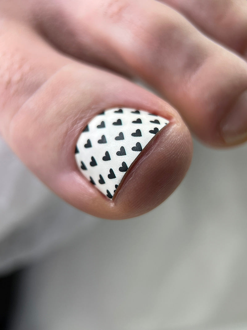 Pedicure Black Hearts. Milky Background. Nail wrap WR-726