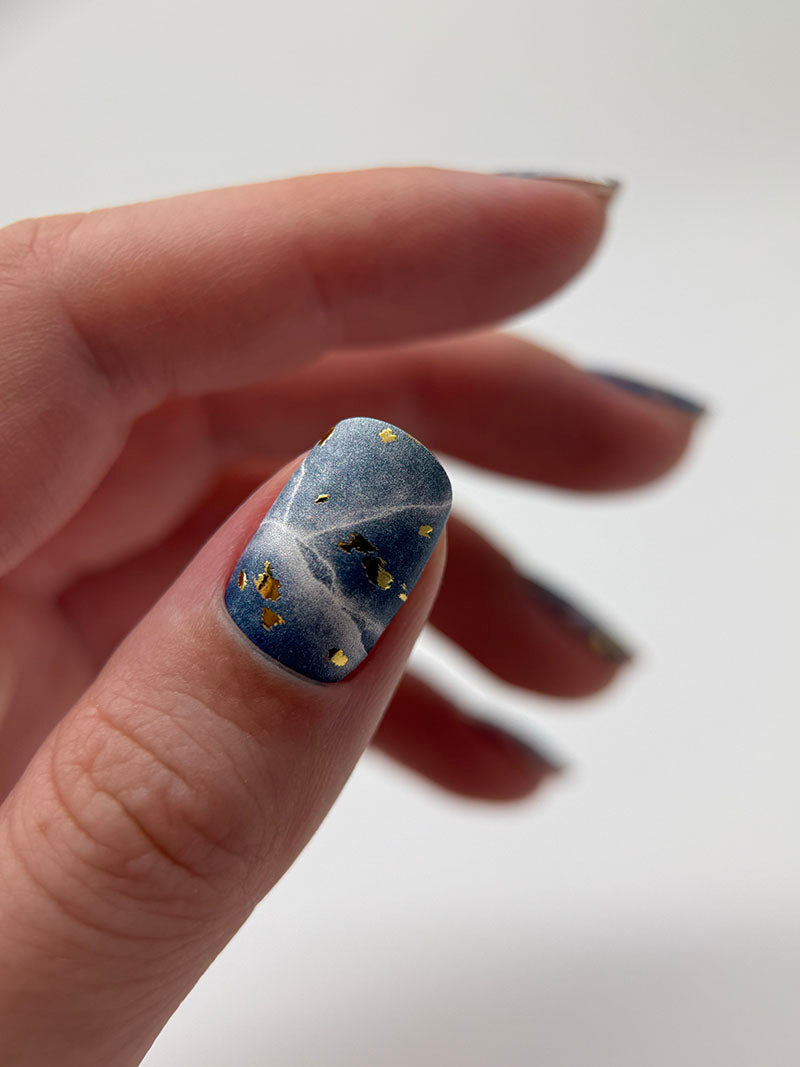 Manicure Cracks on dark blue. Gold Foil. Nail wraps WM-429