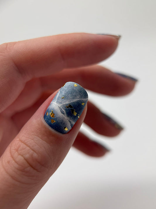 Manicure Cracks on dark blue. Gold Foil. Nail wraps WM-429