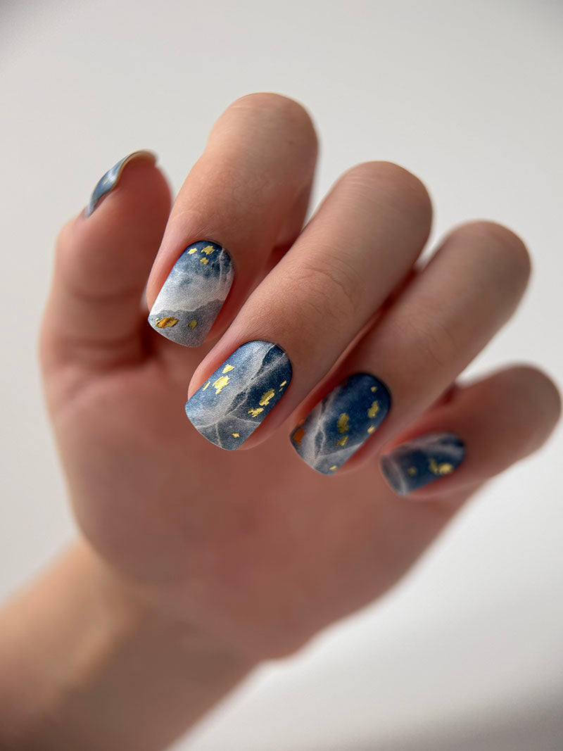 Manicure Cracks on dark blue. Gold Foil. Nail wraps WM-429