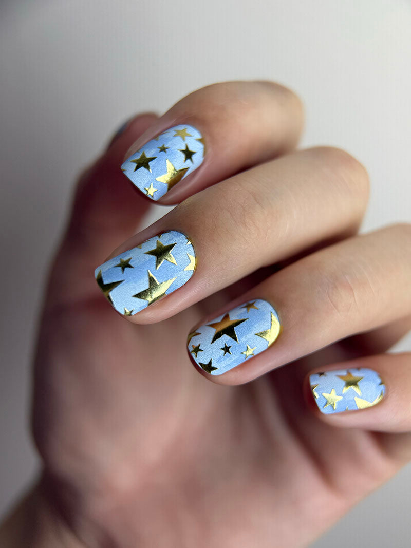 Manicure Stars. Blue Background. Gold Foil. Nail wraps WM-600