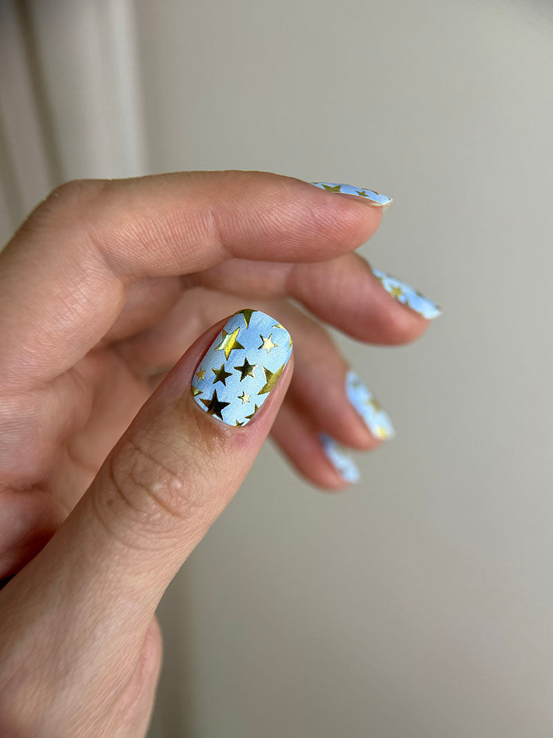 Manicure Stars. Blue Background. Gold Foil. Nail wraps WM-600