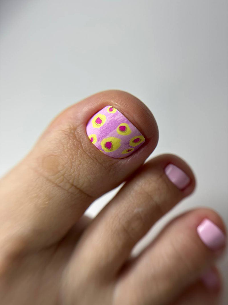 Pedicure Yellow Spots. Pink Background. Foil gold. Nail wrap WR-602