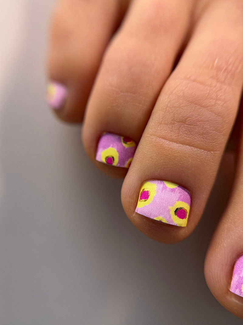 Pedicure Yellow Spots. Pink Background. Foil gold. Nail wrap WR-602