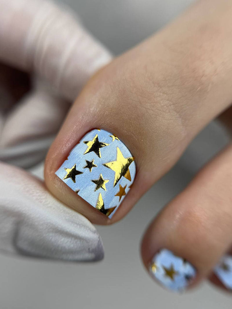 Pedicure Stars. Blue Background. Foil gold. Nail wrap WR-607