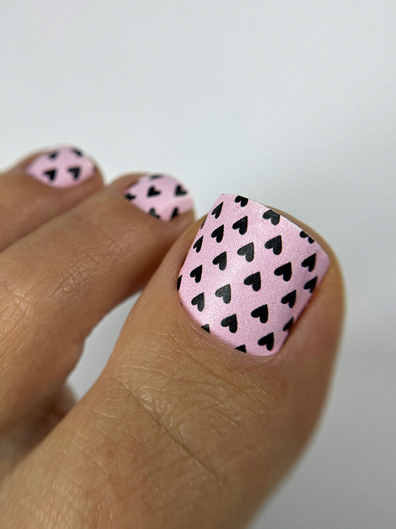 Pedicure Black Hearts. Pink Background. Nail wrap WR-727