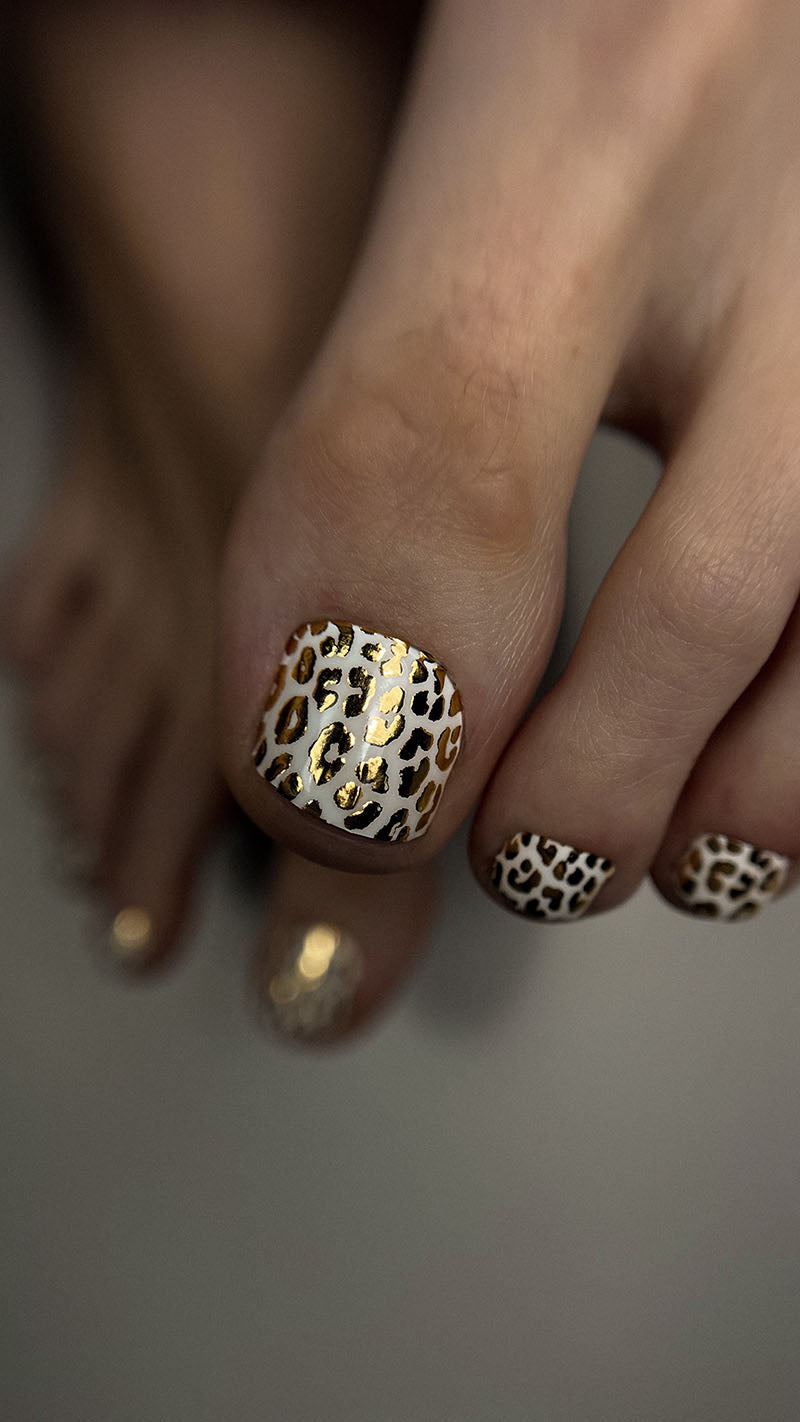 Pedicure Leo. White background. Foil gold. Nail wrap WR-839