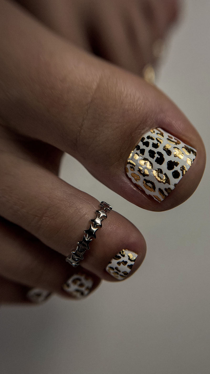 Pedicure Leo. White background. Foil gold. Nail wrap WR-839