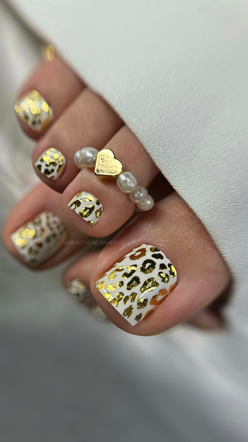 Pedicure Leo. White background. Foil gold. Nail wrap WR-839