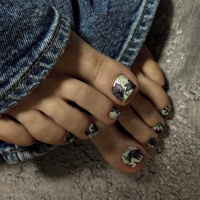 Pedicure Black flowers. Khaki and pink background. Nail wrap WR-853