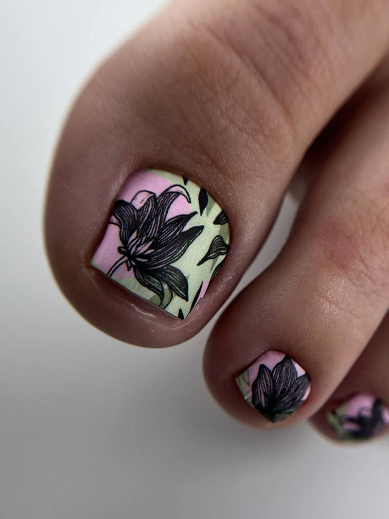 Pedicure Black flowers. Khaki and pink background. Nail wrap WR-853